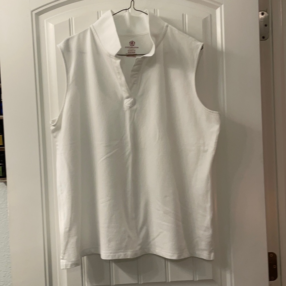 White sleeveless colored golf shirt. Gently worn no spots